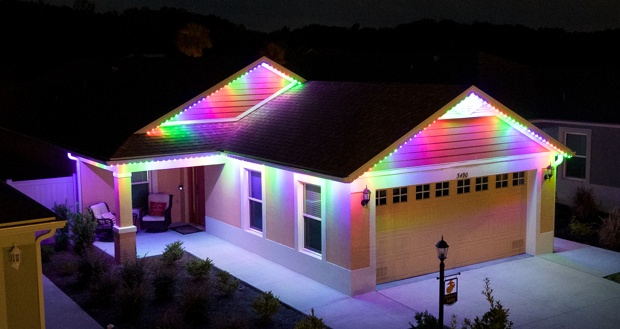 Multicolor permanent roofline lighting on a home in The Villages